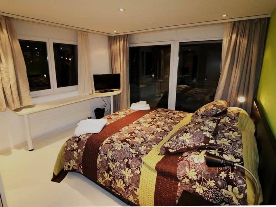 Furniture, Property, Comfort, Wood, Interior Design, Television, Curtain, Flooring, Bed Frame, Floor