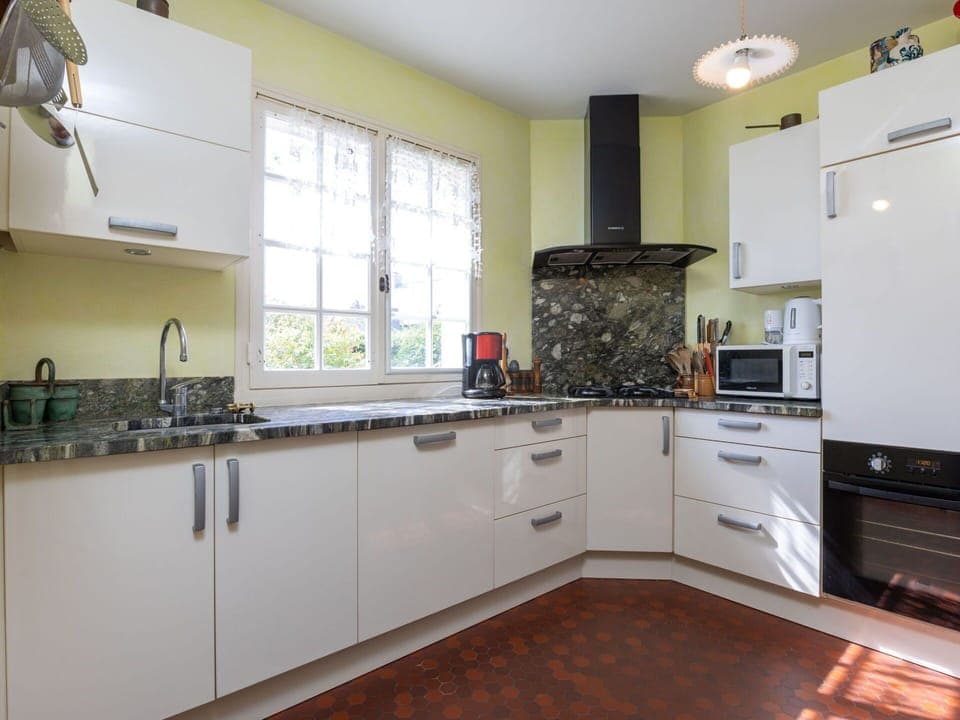 Cabinetry, Countertop, Property, Kitchen Stove, Kitchen Appliance, Kitchen, Kitchen Sink, Wood, Interior Design, Lighting