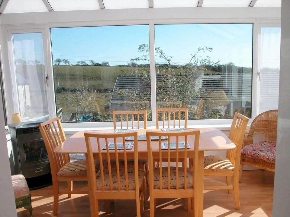 Conservatory with dining table and chairs