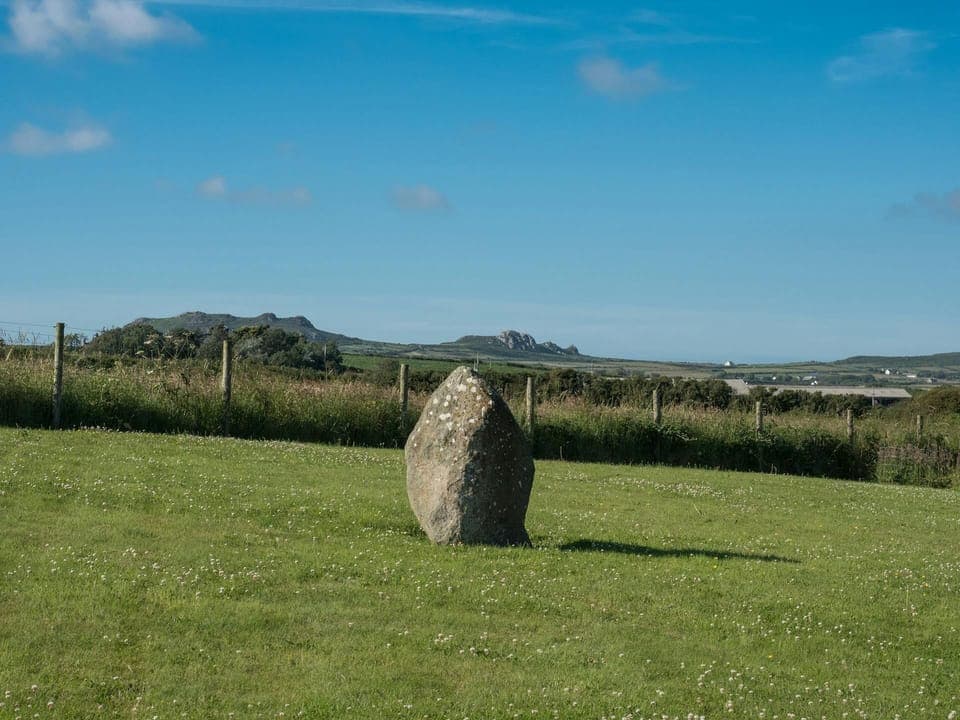 Countryside view with standing stone