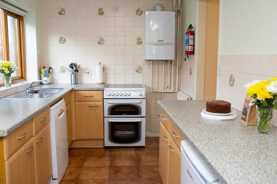 Electric hob and oven, base cupboards and plenty of work surface