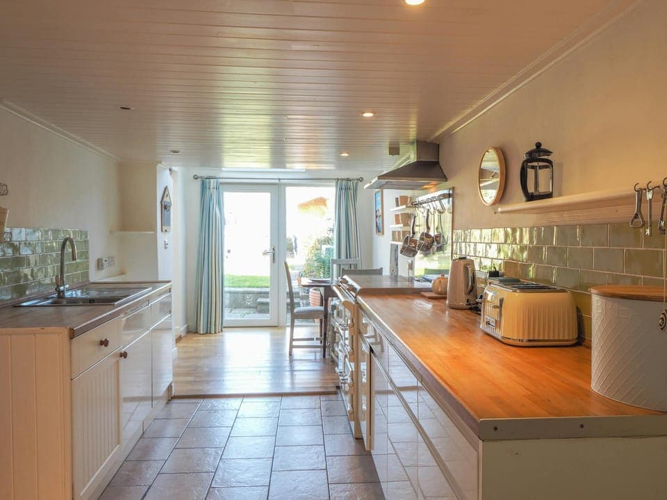 Kitchen floor cabinets, toaster, kettle, sink