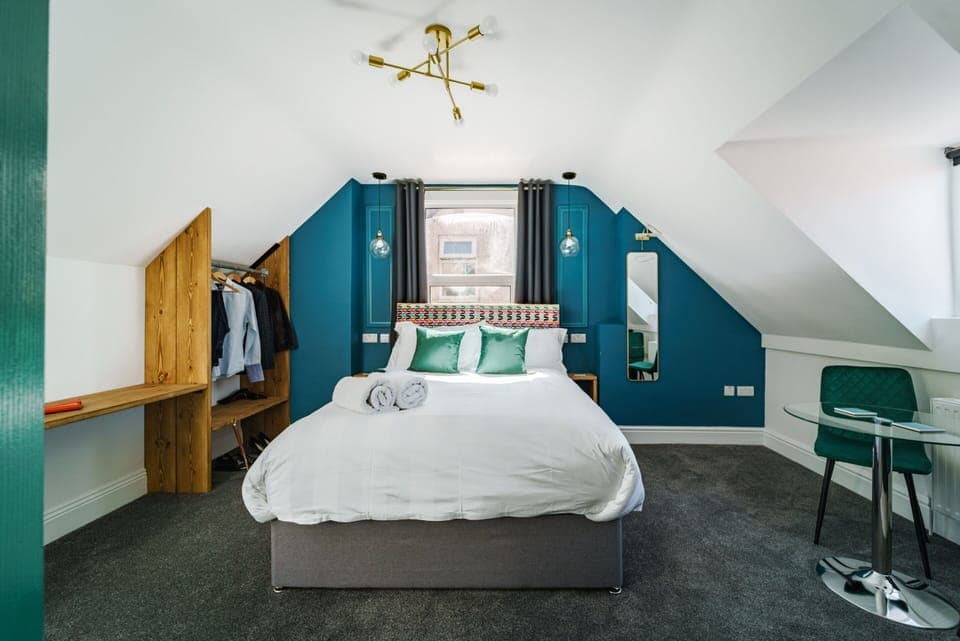 Studio 7 Bed, window, wardrobe