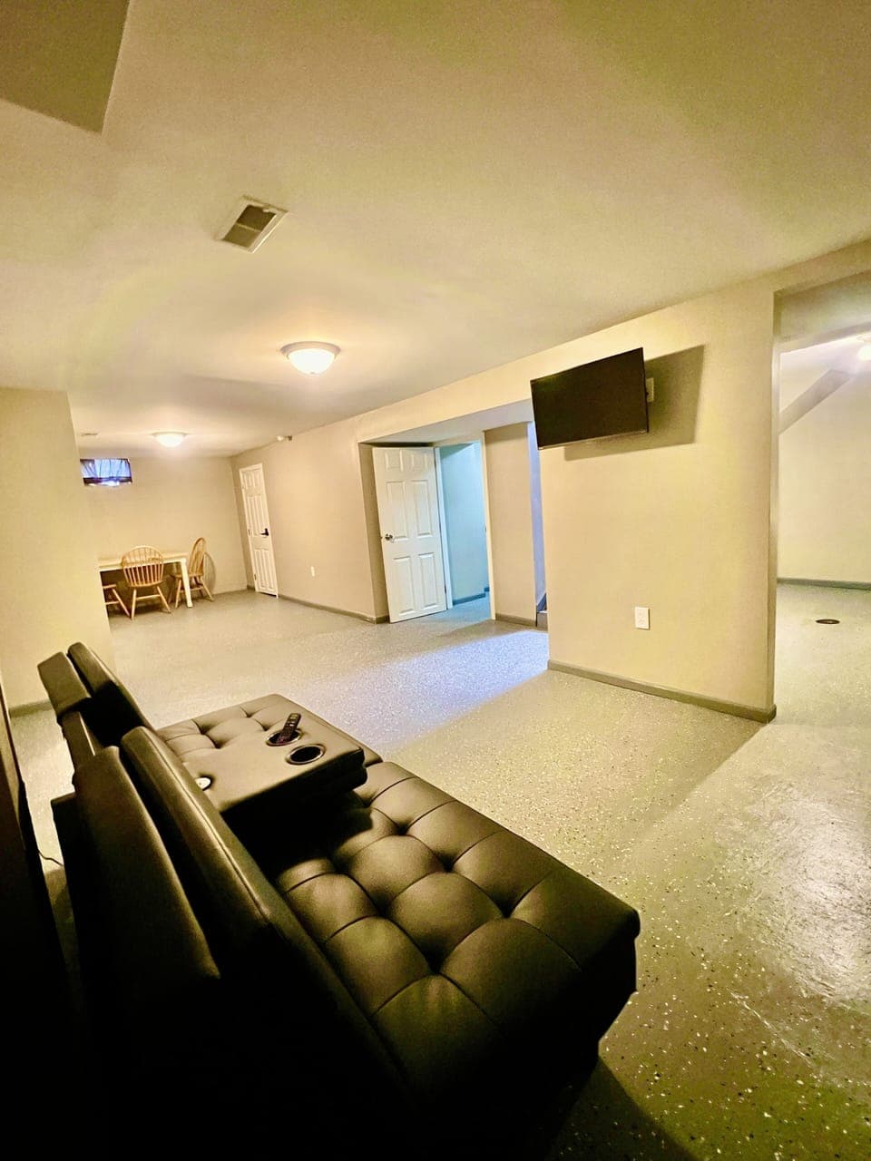 Table/chairs, couch & TV located in basement.  