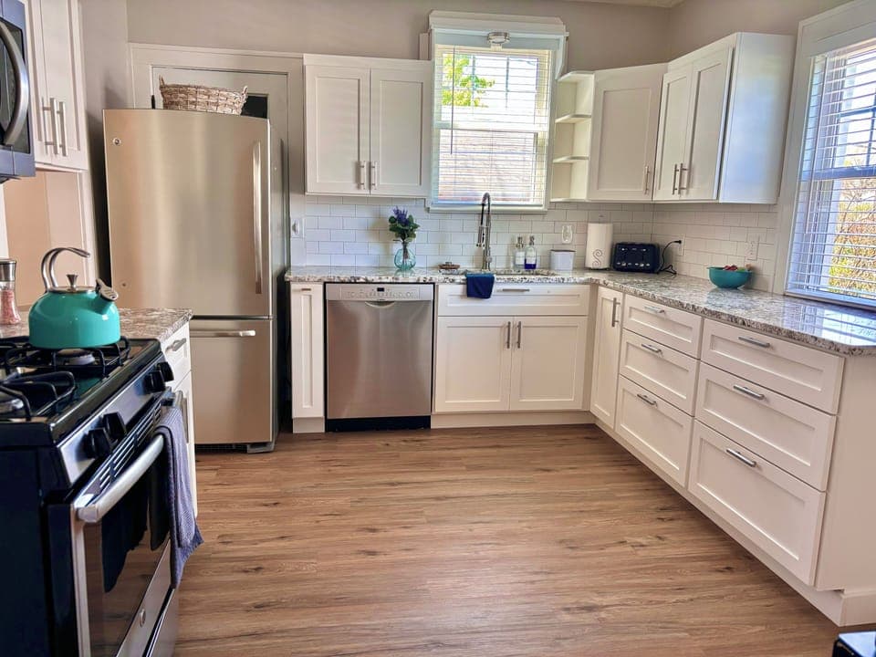 Fully stocked kitchen with dishwasher and Amish-built cabinetry