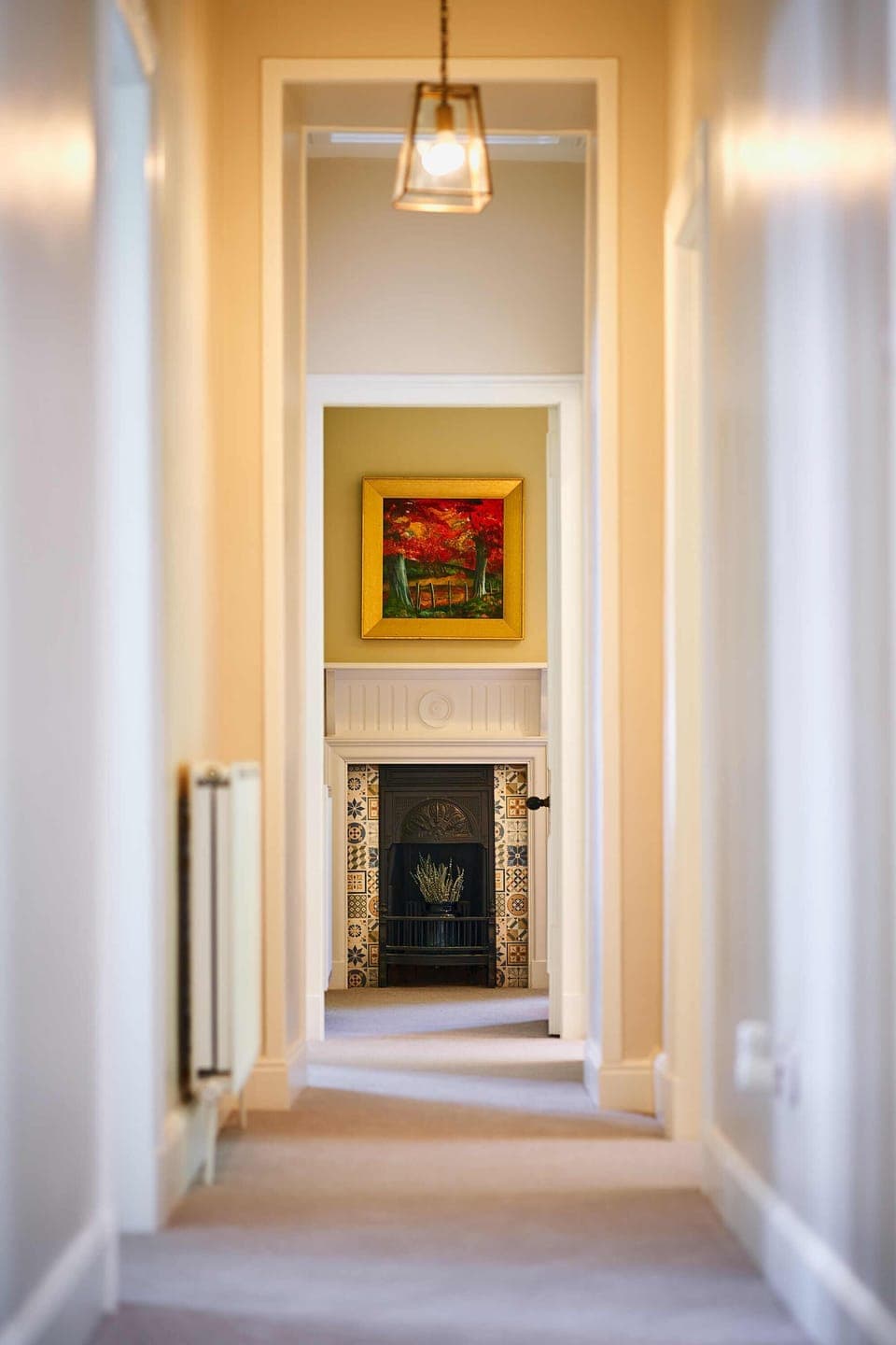 Beech bedroom traditional fireplace and original painting of surrounding trees.