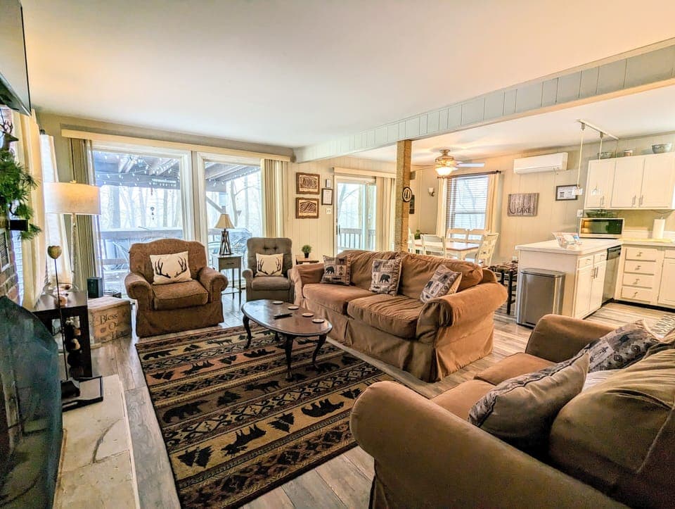 Living space flooded with natural light and ample seating.
