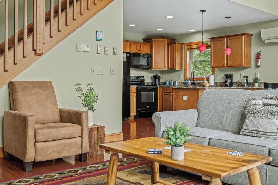 Open, airy living room with a comfortable couch and plenty of natural light.