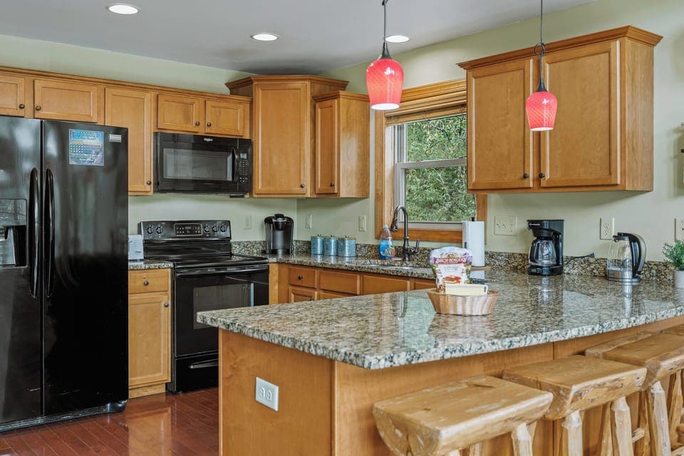 Modern kitchen with sleek appliances and ample counter space.