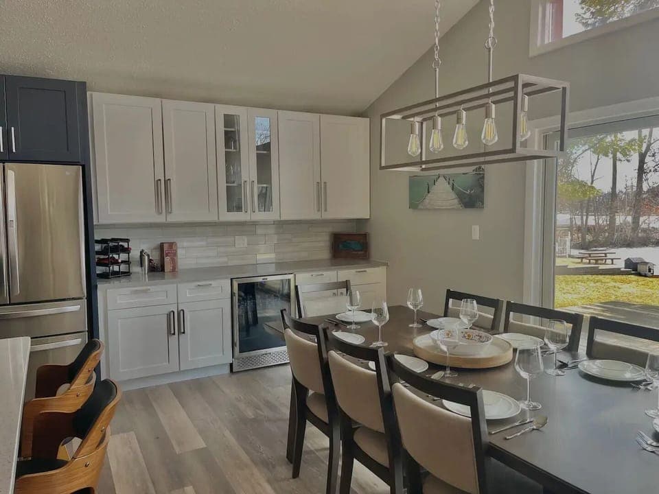 Seating for 8 at the dining table. Additional seating via benches in closets