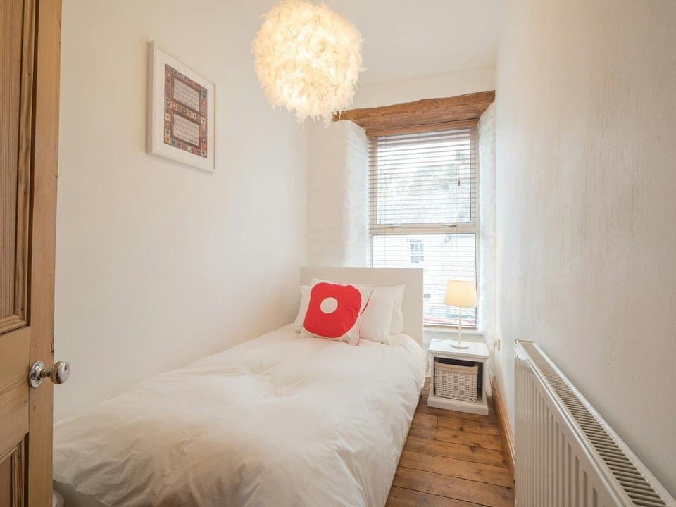 Single bed and bedside cabinet and lamp