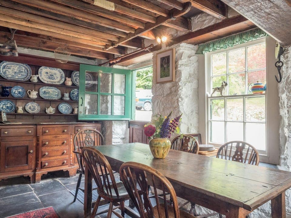 Kitchen with dining table and chairs, stable door, large dresser with crockery