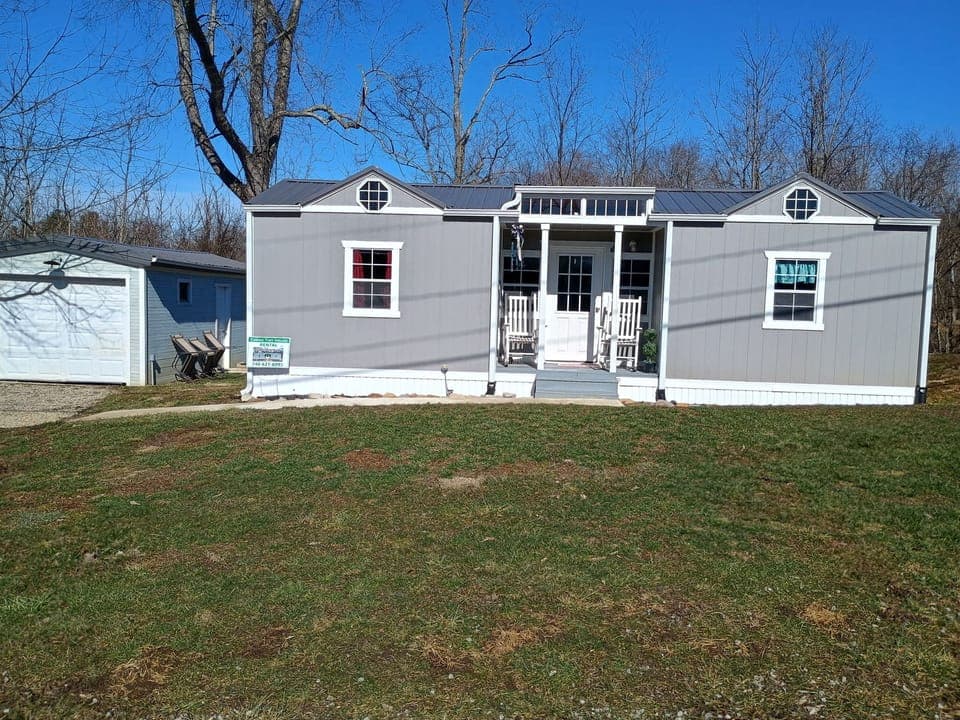 Front view of the Tiny House which includes additional parking to the left side