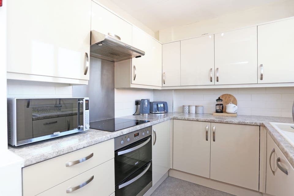 Fully equipped kitchen area on first floor