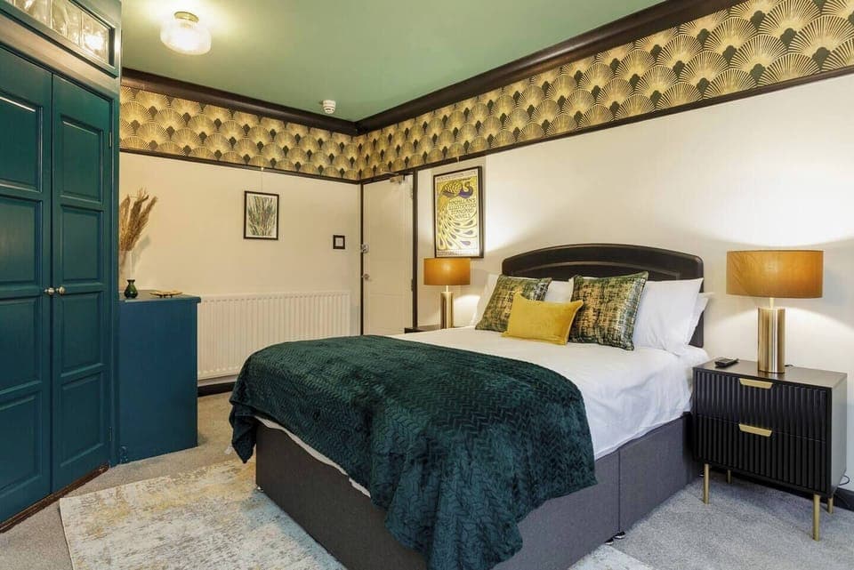 Bedroom Retreat: Unwind in this stylish room with chic decor and plush bedding for ultimate relaxation!