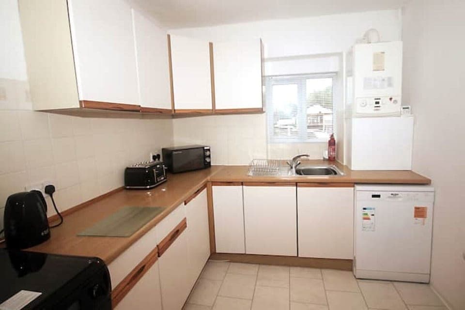 Kitchen with oven, grill, hob, kettle, toaster, microwave, dishwasher, fridge