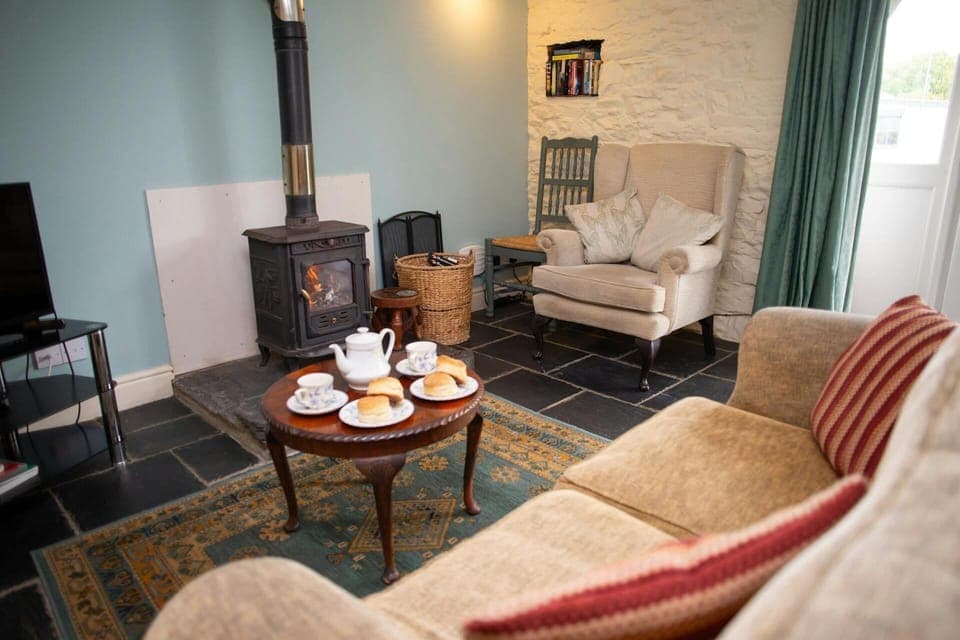 Lounge area with slate floors and wood burner