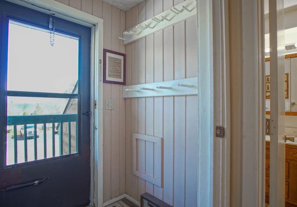 Storage area for ski equipment located just inside the front door