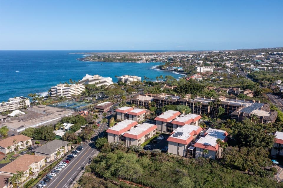 Drone views of your perfect paradise getaway in the middle of it all- walk to the beach or the bustling downtown for a bite!