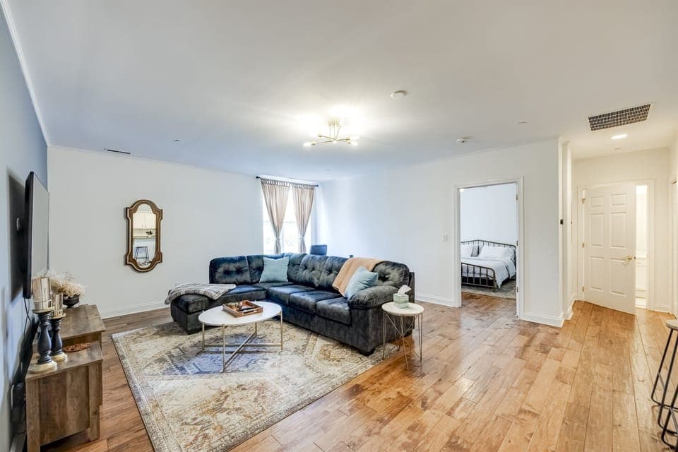 Full view of the living room showcasing the open-plan layout that extends into the dining area—ideal for entertaining