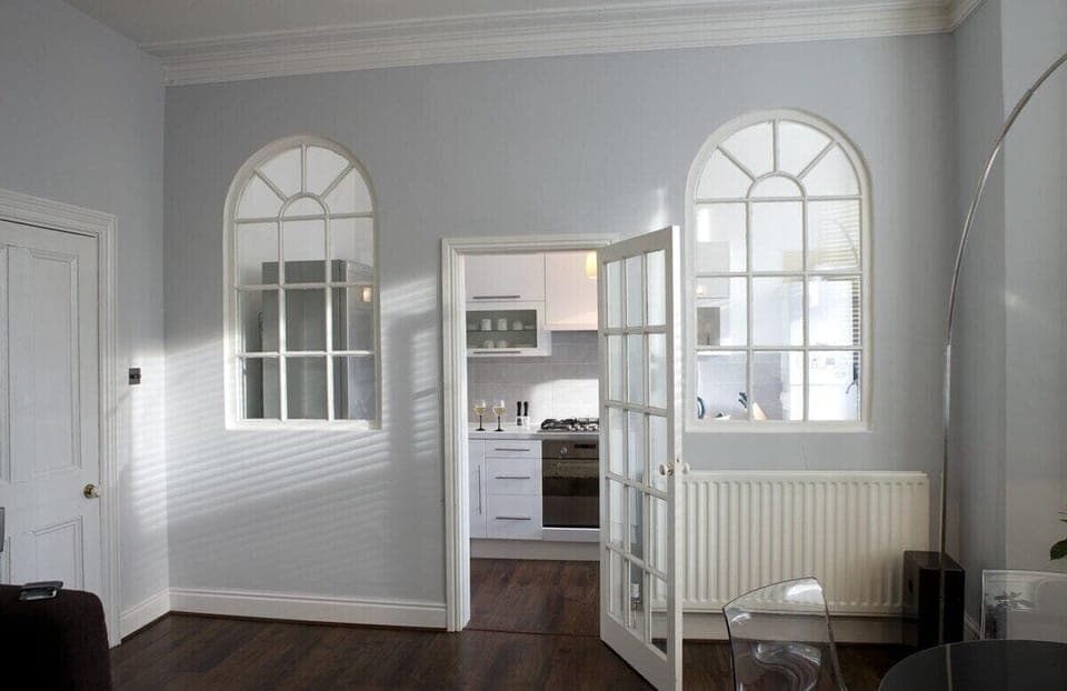 Entrance to kitchen area highlights the high ceilings