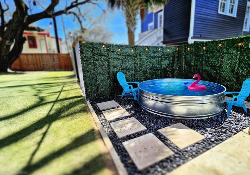 Cool off outdoors while catching the afternoon sun under the palm tree