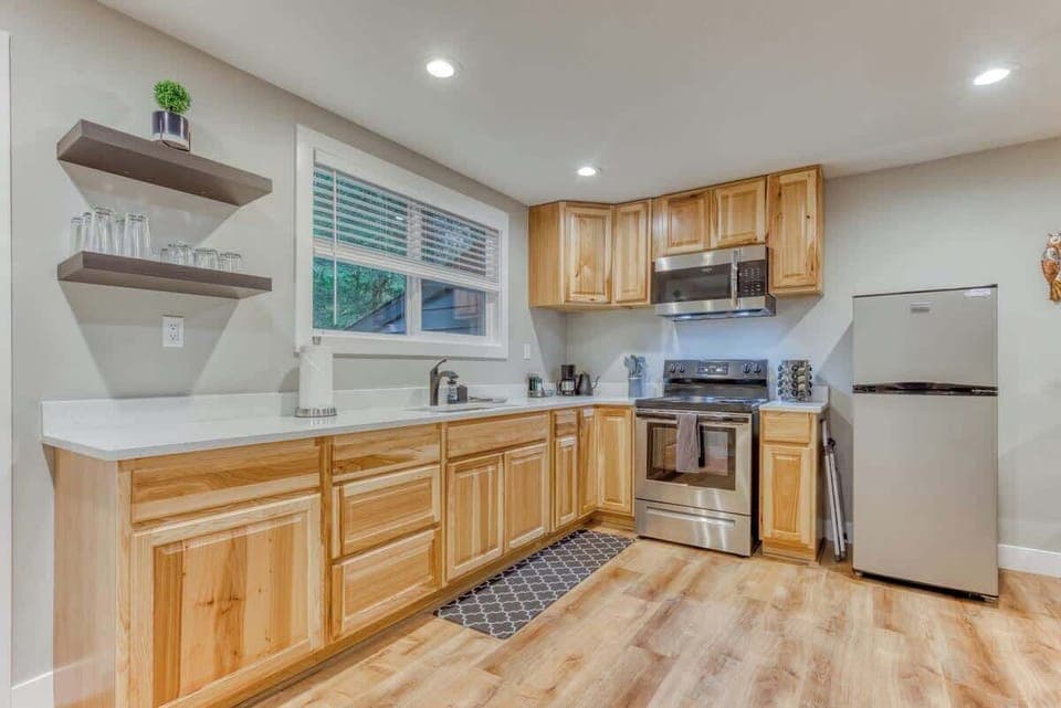 Spacious full kitchen with stainless steel appliances, large counters, and all the essentials—perfect for cooking during your vacation or extended stay.