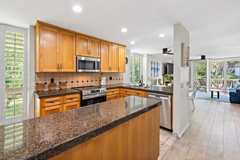Beautiful granite countertops and plenty of  cabinet space to store groceries and other necessities.