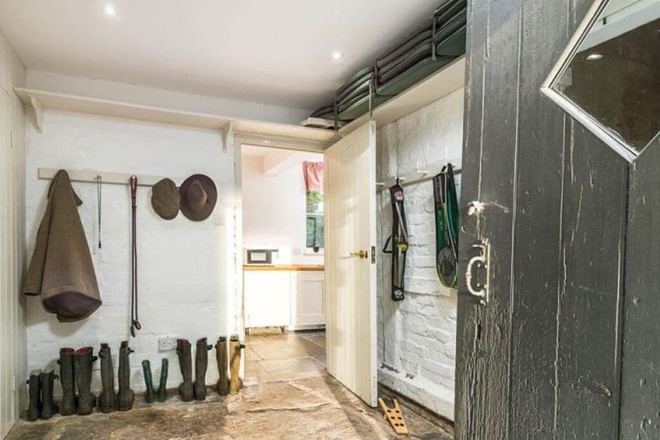 The boot room with plenty of space for coats wellies 2 dog crates and sports bag