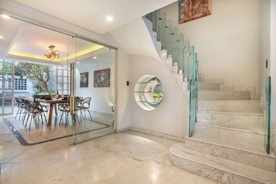 An open central space connecting dining areas and upper floors.