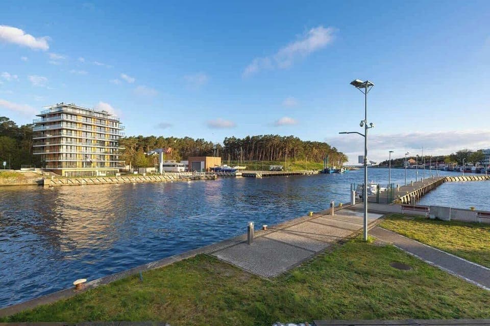 A view of the building from the other side of the river. 