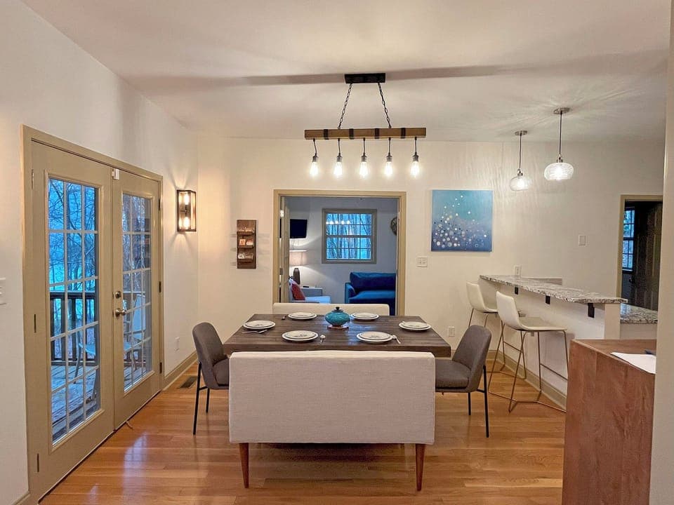 Dining Table seats 8, plus 2 additional seats at the Kitchen breakfast bar.  Dining area also has access to the wrap-around Screen Porch.