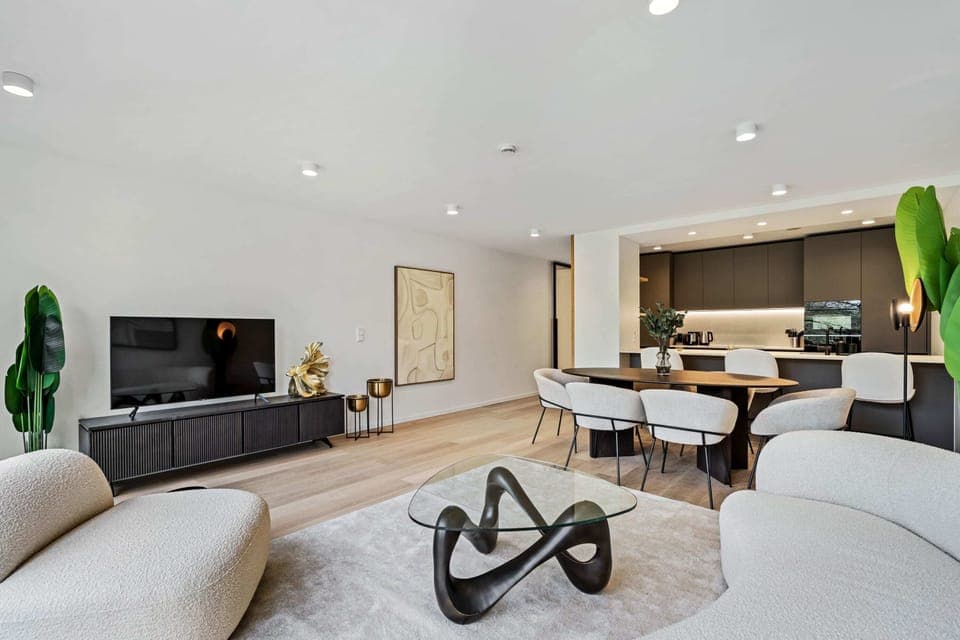 Chic minimalism shines in this well-appointed living space, welcoming you to unwind.