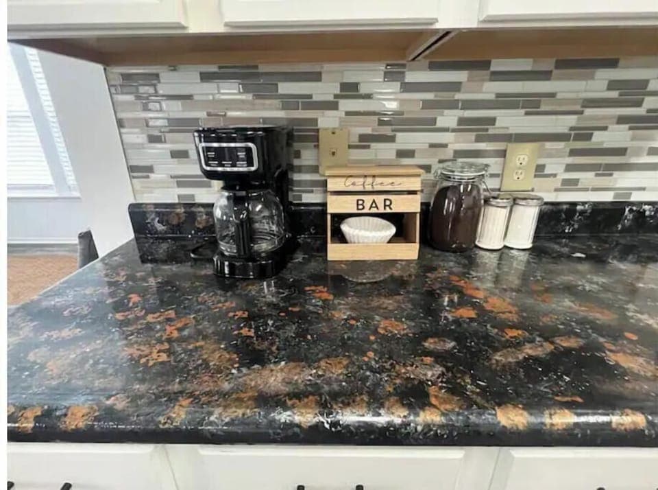 Kitchen with all essentials plus kids’ cutlery. Easy access to living spaces.
