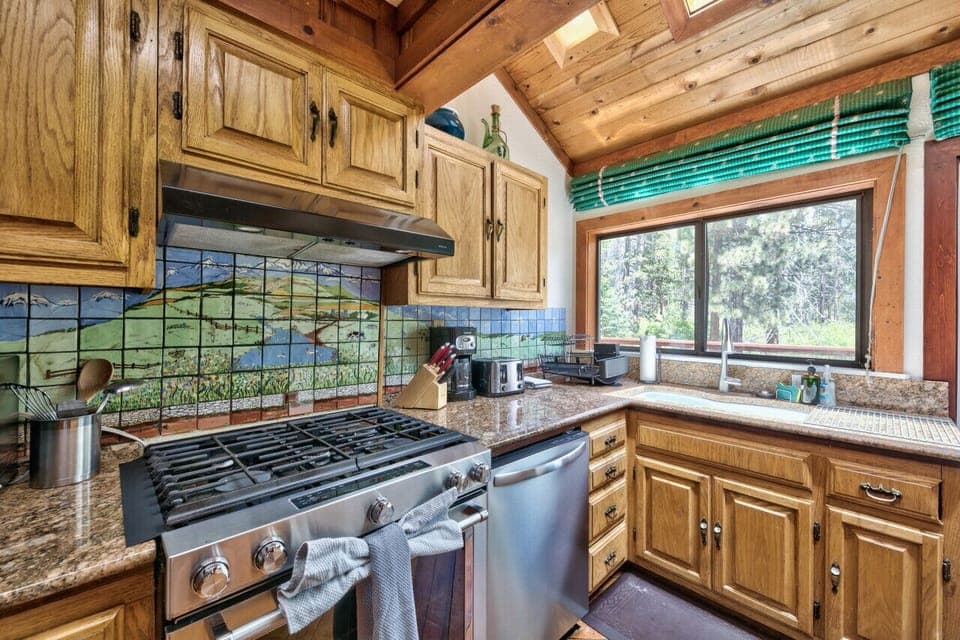 Nicely appointed kitchen in center of home and opens to back deck.