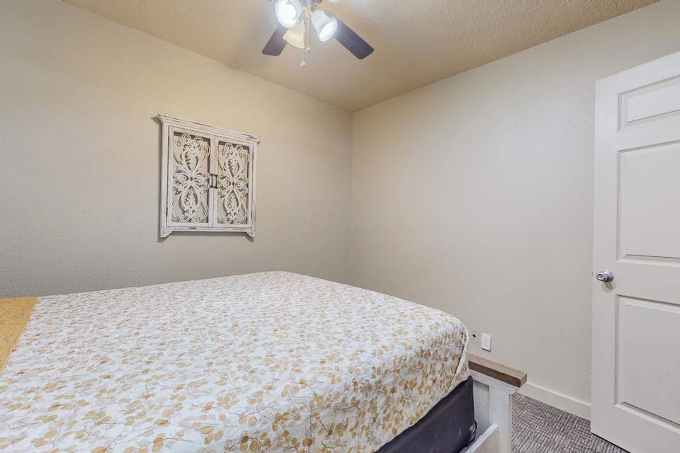 Queen bedroom located near the living room