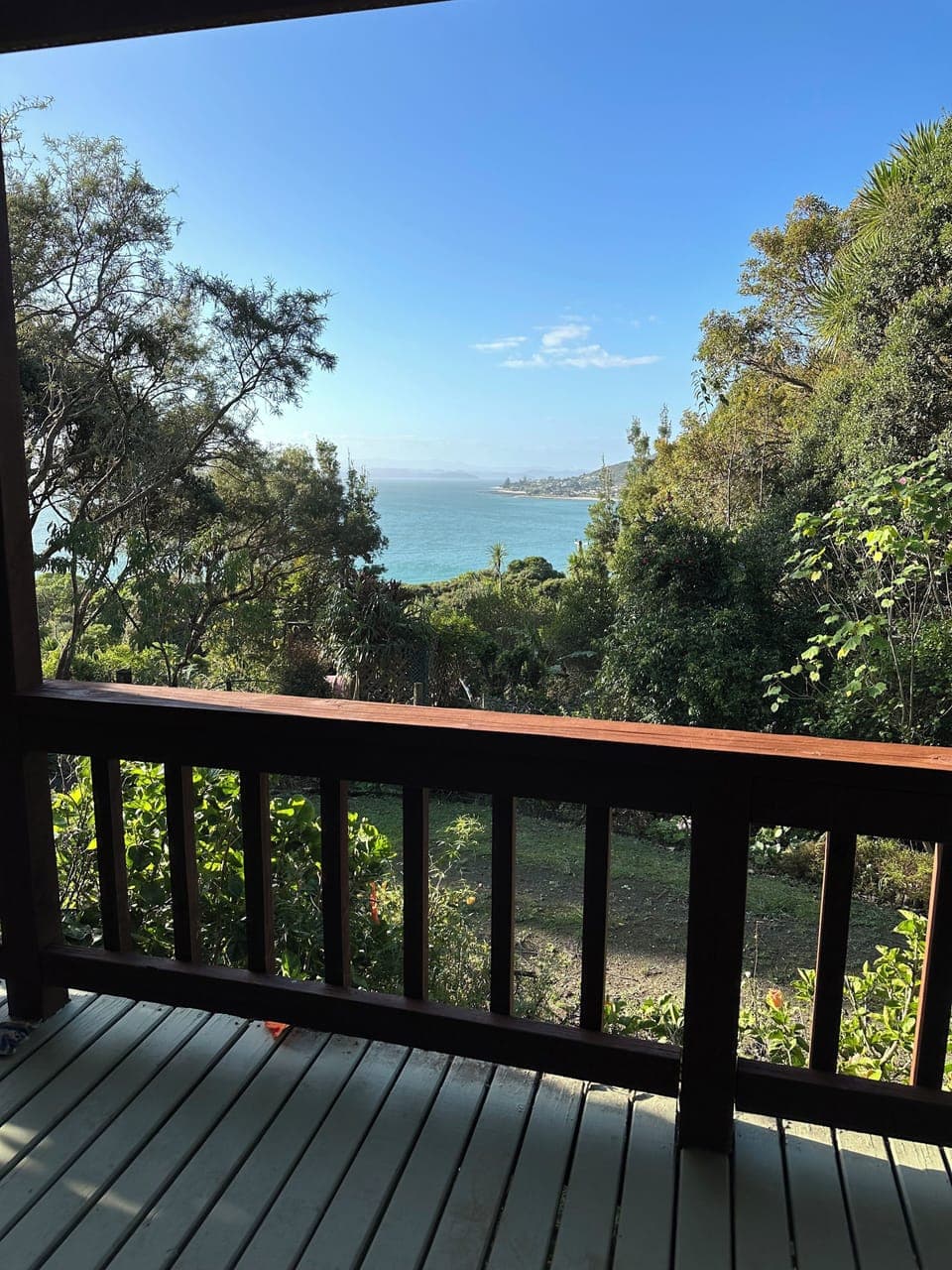 Covered deck area with seating. Gate for keeping small children and pets safe.