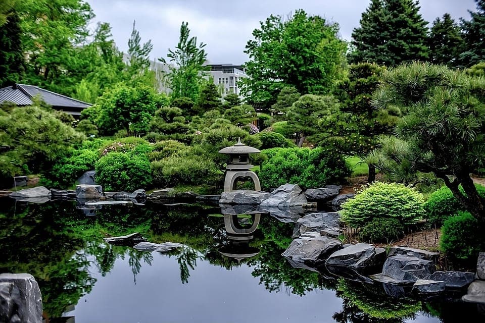Unwind beside tranquil waters framed by lush, manicured greenery.