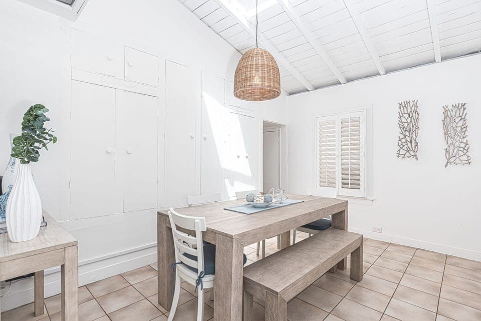 Gather around the dining or game table in the dining room, comfortably seating six, where meals and memories are shared.
                