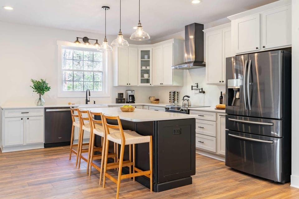 Modern Kitchen Equipped with Black Stainless Steel Appliances for Gourmet Cooking - The Regal - Sevierville, TN