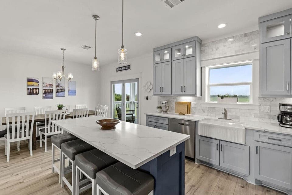Brunch, birthdays, beach snacks—this fully stocked kitchen includes a signature KitchenAid Stand Mixer and plenty of seating.