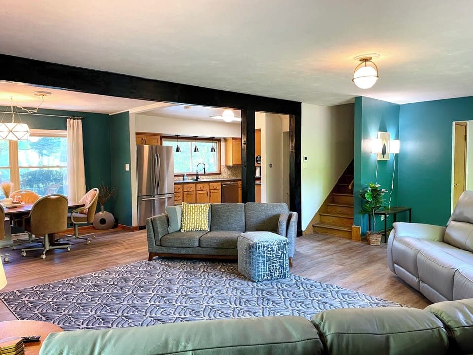 Open Concept for Gatherings! The open-concept living room at Riverside Paradise is perfect for connecting. Kids can play, families can dine, and everyone can enjoy movies on the 65" Fire TV. Custom wall art adds a unique touch to this spacious haven