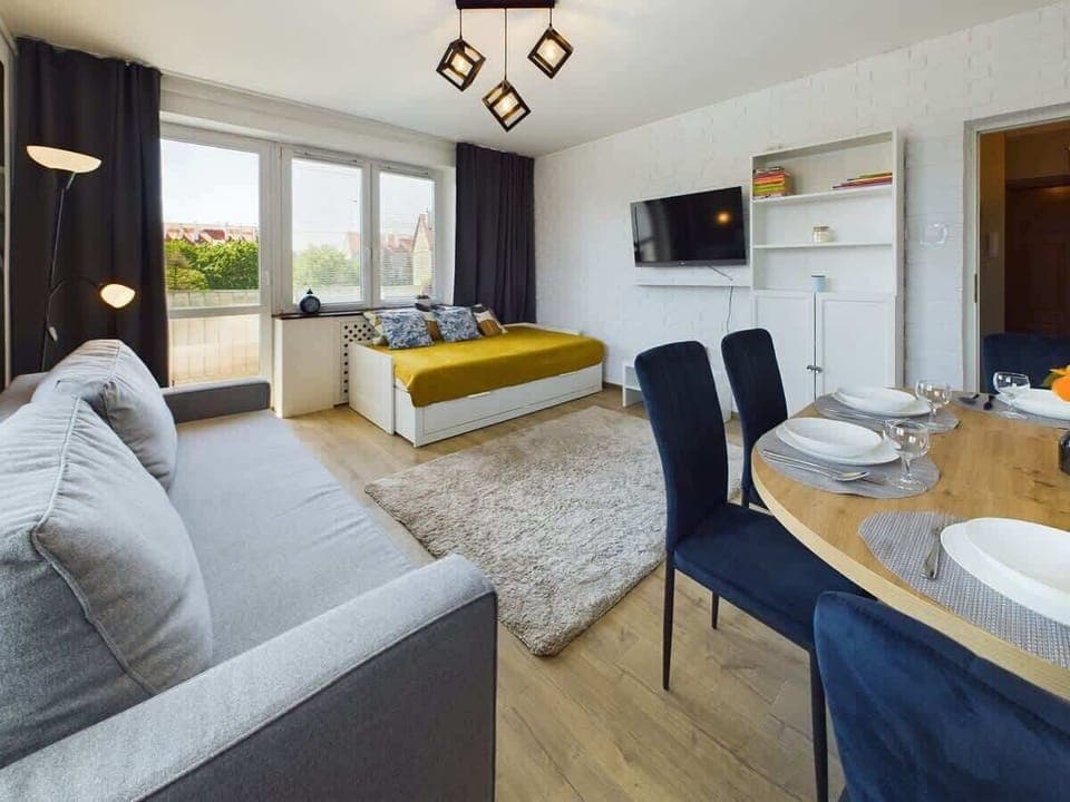 Charming living space with plush seating and modern decor, ideal for relaxing.

