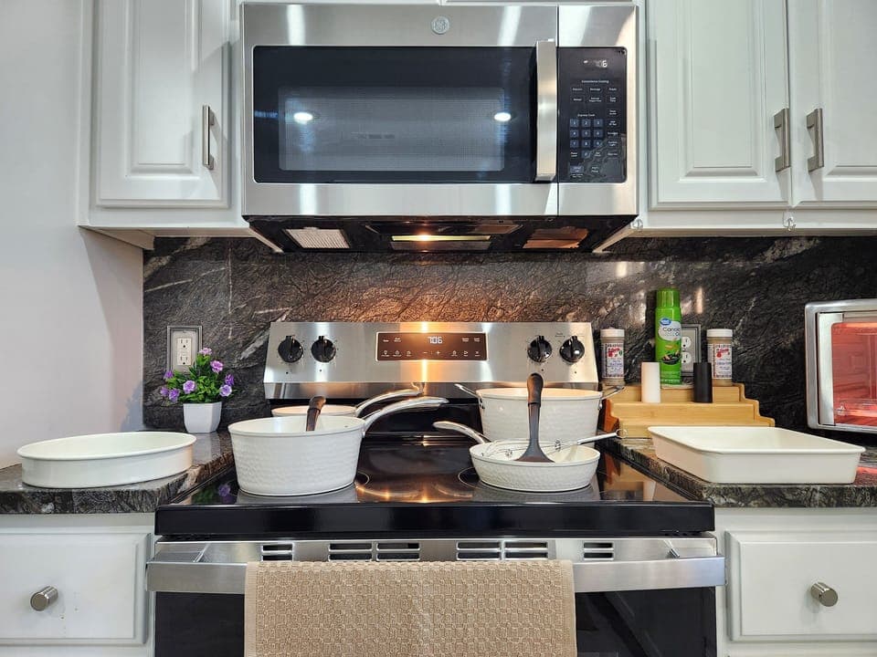 New stainless steel kitchen and cookware.