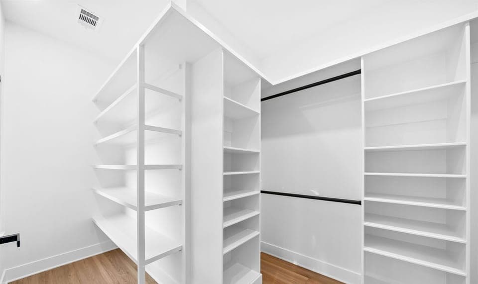 Every fashion lover's dream closet. Plenty of room for clothes, shoes, and accessories.