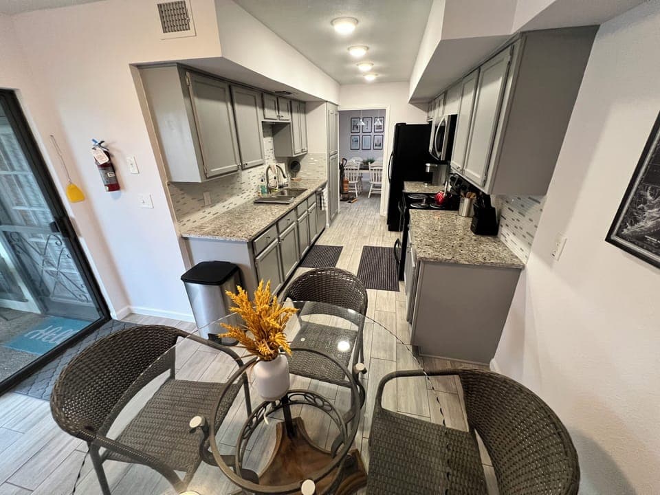 Kitchen with breakfast nook/overflow table. 