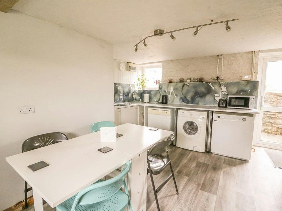 Dining table and chairs, washing machine and dishwasher