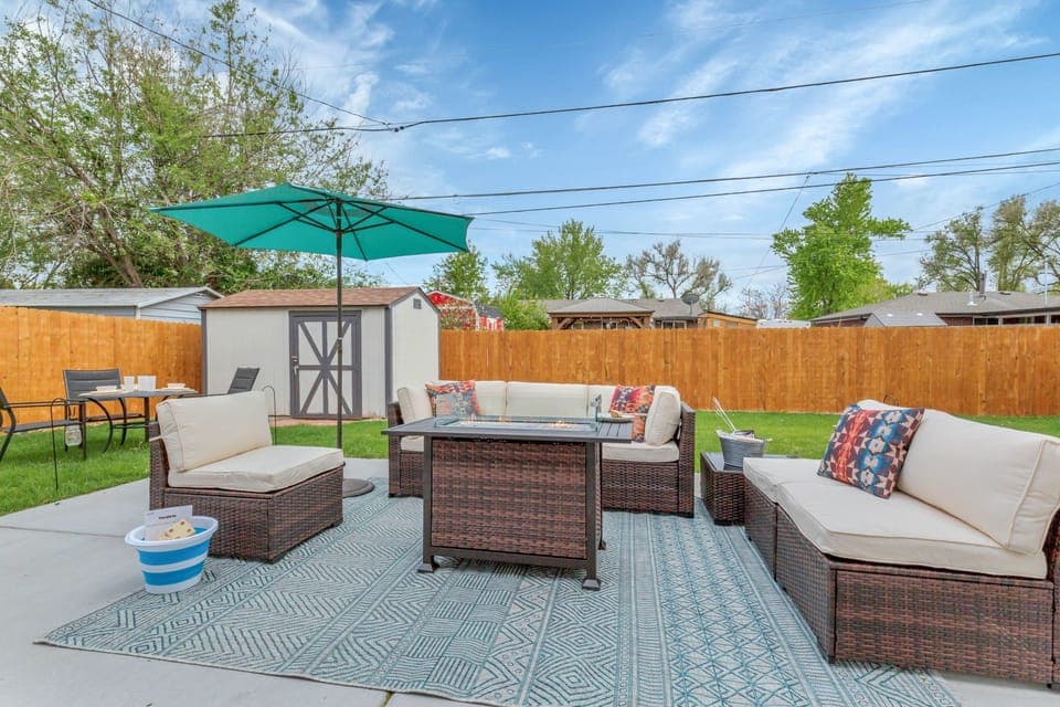 Patio with cozy lounge seating and fire table