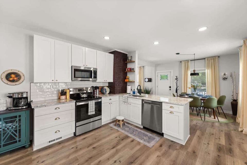 Walking into this kitchen feels like stepping into a Pinterest board - white cabinets and hardwood floors that make you want to cook up a storm in style! ✨