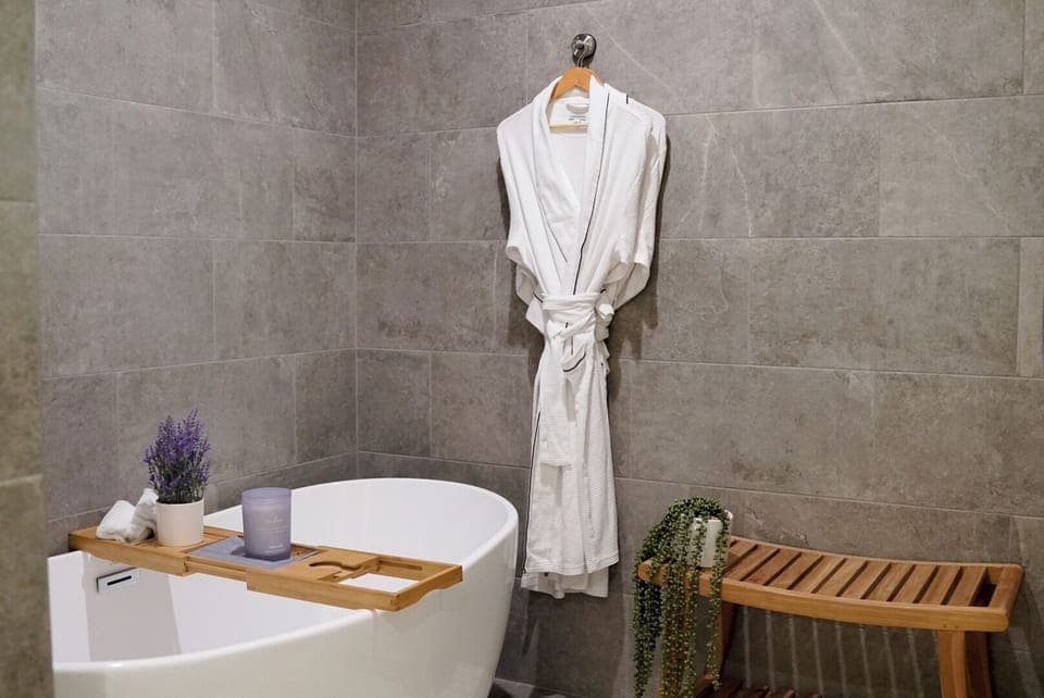 Walk-in Soaking Tub w/ waterfall tub filler.